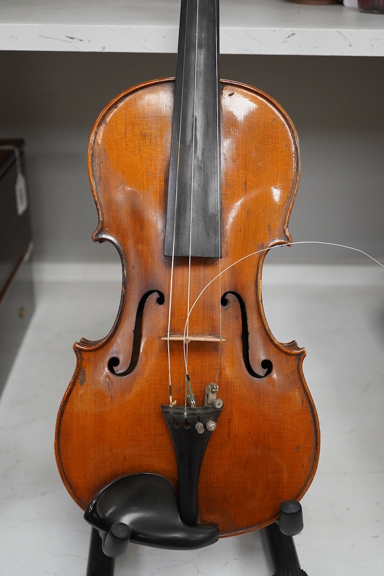A late 19th century German violin in a Hill & Son oak case, with Hill canvas slip cover, together with an unbranded silver mounted bow, and another, ivory submission ref: 9HJU3B45 and ZC2E1GCP